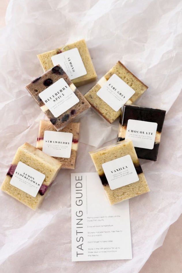 Assorted small boxes with labels on a light fabric background